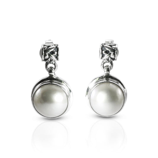 Freshwater Pearl stud earrings set in 925 sterling silver with push back closure decorated with rice bead carving