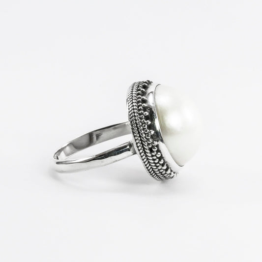 white mabe pearl ring set in 925 sterling silver decorated with dot frame