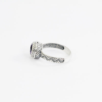 Amethyst solitaire ring handmade bezel set in 925 sterling silver decorated with woven ornament