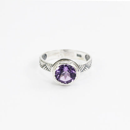 Amethyst solitaire ring handmade bezel set in 925 sterling silver decorated with woven ornament