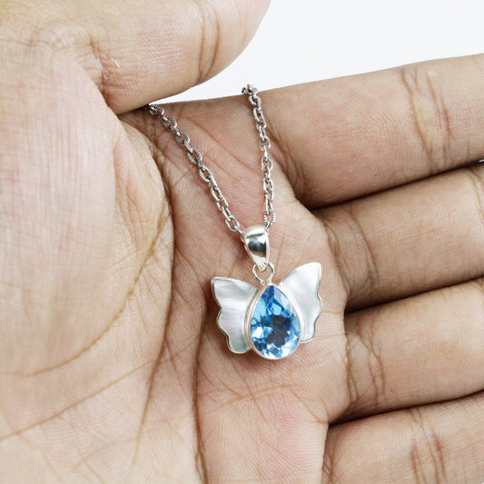 butterfly pendant 925 sterling silver with genuine Swiss blue topaz decorated with white shell