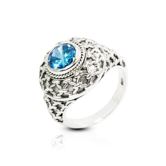 doom ring with genuine blue topaz zirconia decorated with woven web ornament
