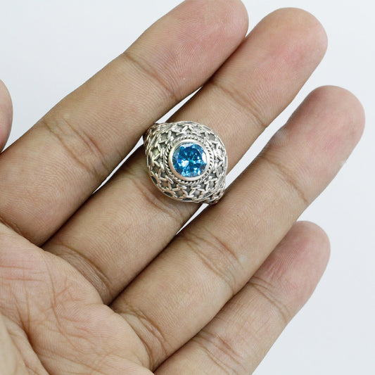 doom ring with genuine blue topaz zirconia decorated with woven web ornament