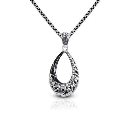 Tear drop pendant 925 sterling silver decorated with swirl filigree ornament and natural black shell