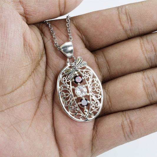 open work filigree pendant 925 sterling silver and 18K gold with genuine red garnet and white topaz decorated with dragonfly ornament