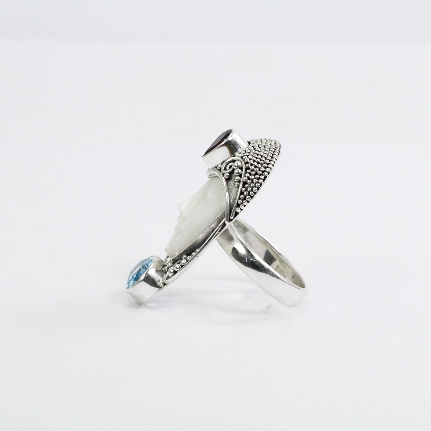 face ring 925 sterling silver with cow bone carving, genuine blue topaz and natural red garnet
