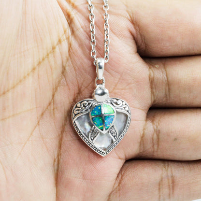Turtle pendant 925 sterling silver decorated with swirl filigree ornament, white shell and created opal