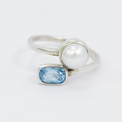 bypass ring with genuine blue topaz and freshwater pearl set in 925 sterling silver