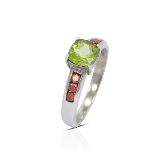 peridot ring  sterling silver decorated with red garnet solitaire style
