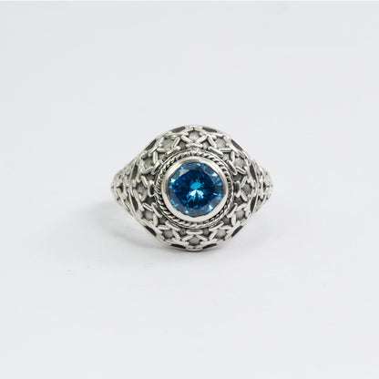 doom ring with genuine blue topaz zirconia decorated with woven web ornament