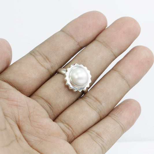 white mabe pearl ring set in 925 sterling silver with gear shape bezel