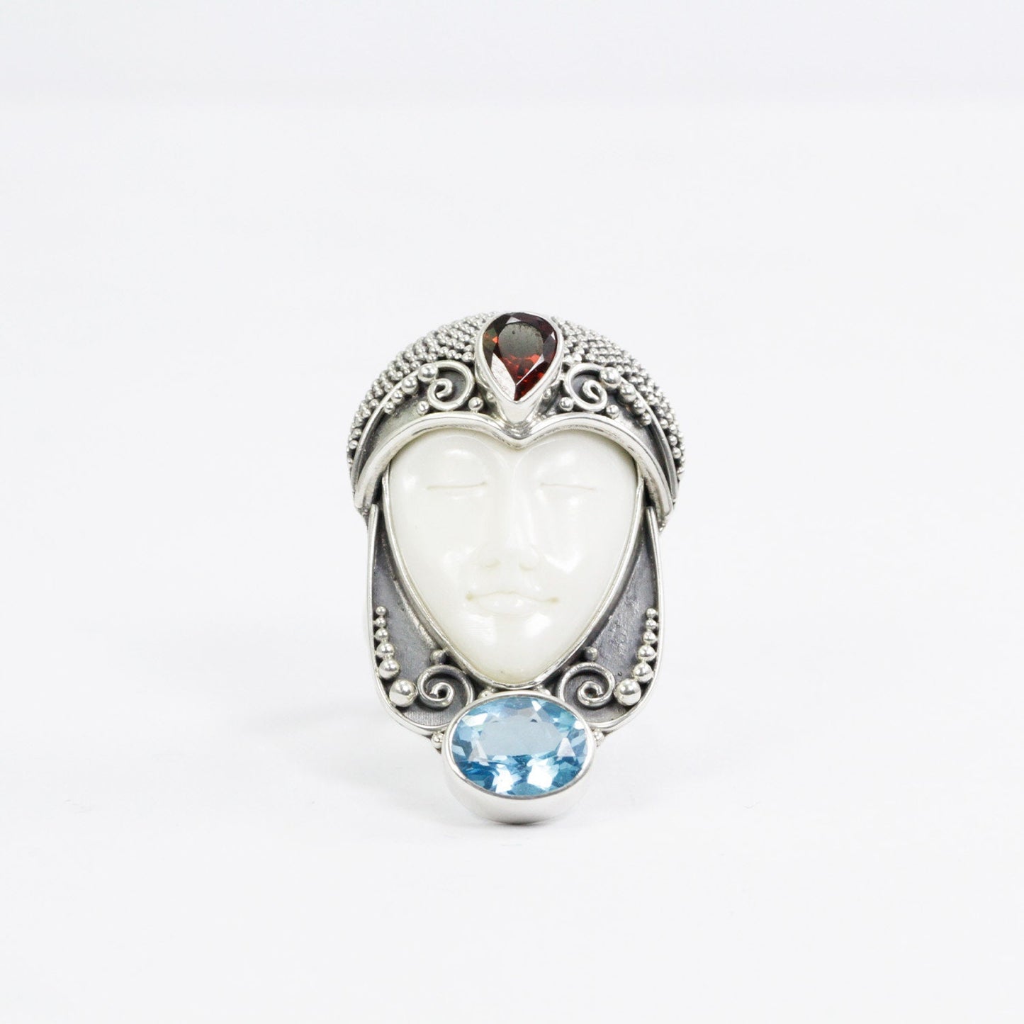 face ring 925 sterling silver with cow bone carving, genuine blue topaz and natural red garnet