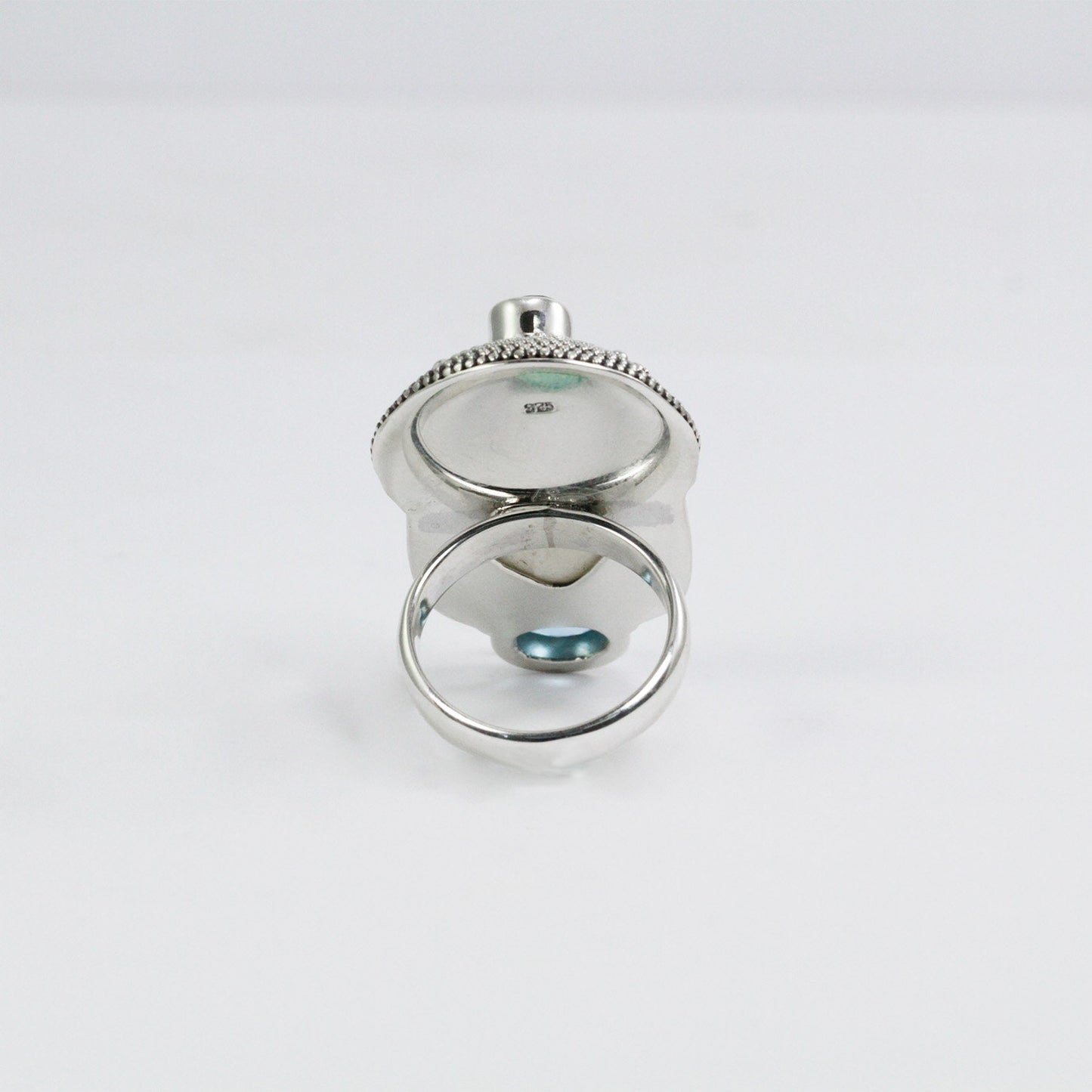 face ring 925 sterling silver with cow bone carving, genuine blue topaz and natural red garnet