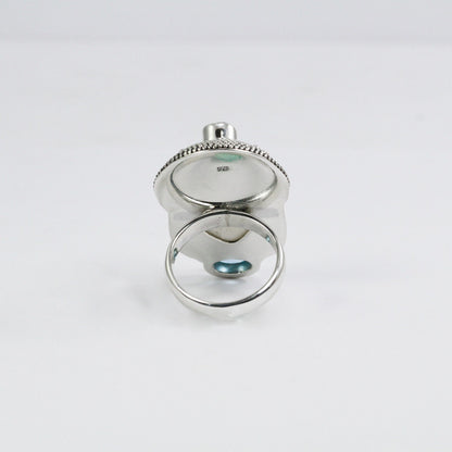 face ring 925 sterling silver with cow bone carving, genuine blue topaz and natural red garnet