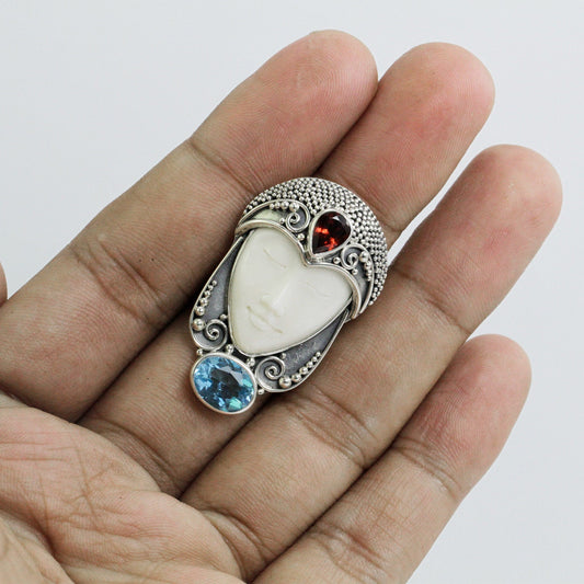 face ring 925 sterling silver with cow bone carving, genuine blue topaz and natural red garnet