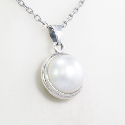 round pearl pendant 925 sterling silver bezel set decorated with open work filigree at the back side