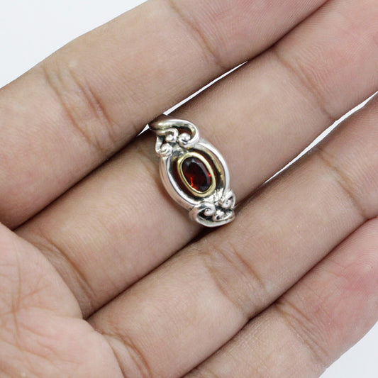 red garnet ring 925 sterling silver decorated with gold bezel and swirl filigree ornament