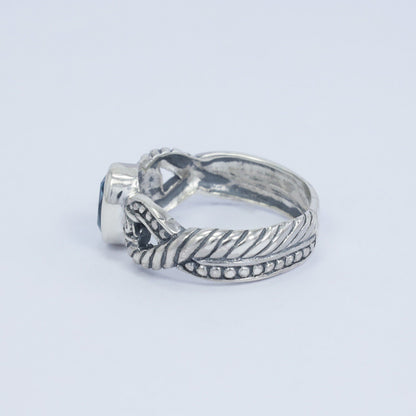 blue topaz ring set in 925 sterling silver decorated with cable ornament