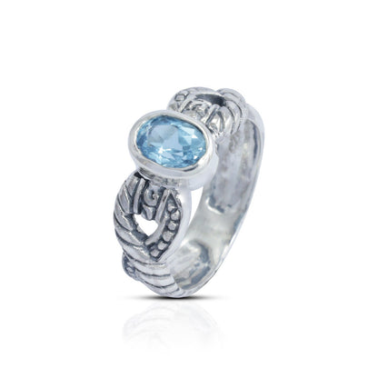 blue topaz ring set in 925 sterling silver decorated with cable ornament