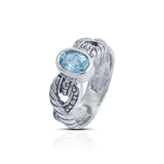 blue topaz ring set in 925 sterling silver decorated with cable ornament