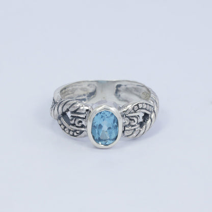blue topaz ring set in 925 sterling silver decorated with cable ornament