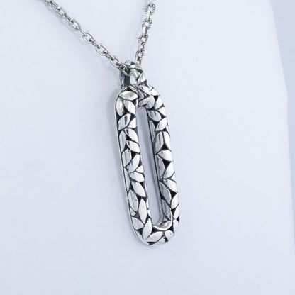 925 sterling silver rectangular pendant decorated with seed ornament and antique finishing
