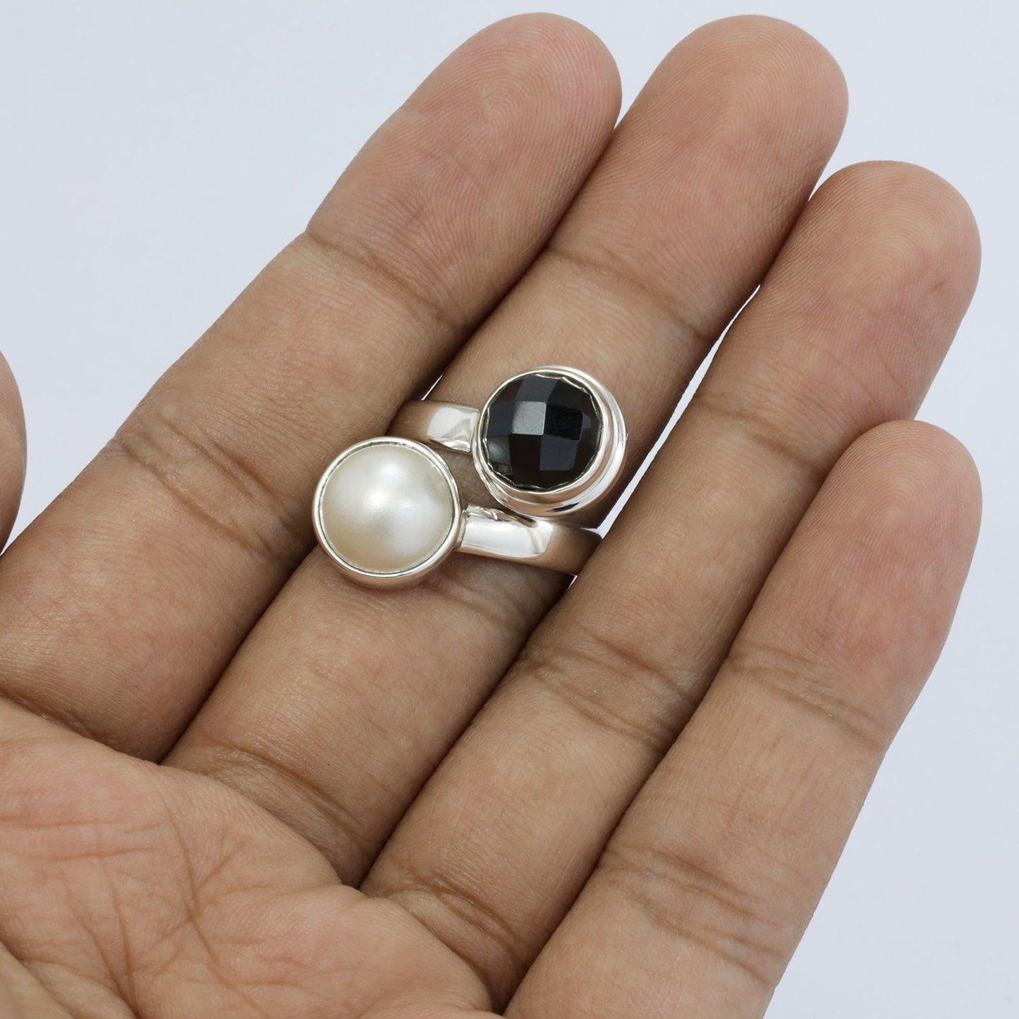 black and with ring 925 sterling silver bypass style bezel set genuine white mabe pearl and natural onyx