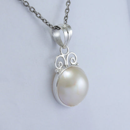 white Mabe pearl pendant necklace 925 sterling silver decorated with swirl filigree and bezel set