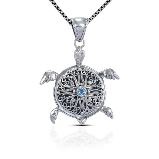 silver turtle pendant necklace decorated with openwork filigree and genuine blue topaz