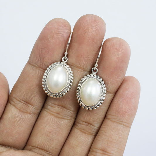 dangle drop oval mabe pearl earrings set in bezel handmade woven chain edge 925 sterling silver, oval pearl earrings
