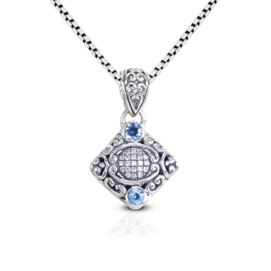 925 sterling silver pendant decorated with Bali inspired ornament and genuine blue topaz