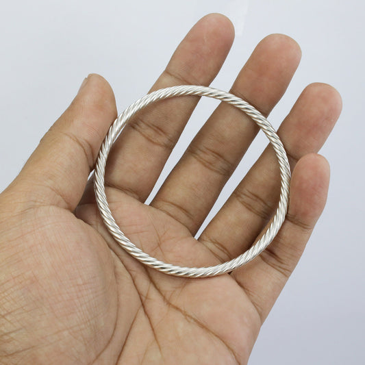 Solid Silver bangle 925 sterling silver with cable style woven in 7" inch circumference
